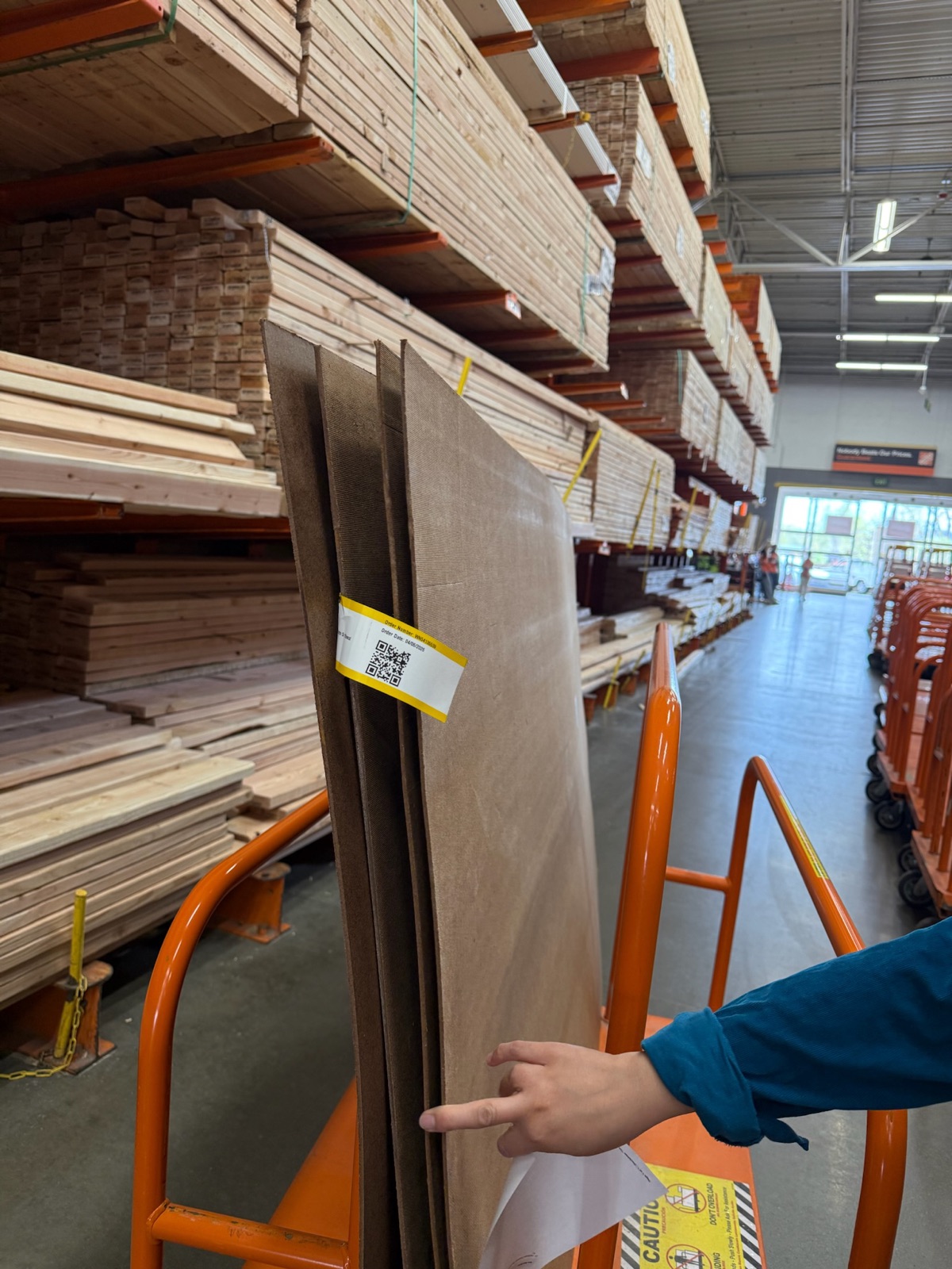 Selecting lumber for the exhibit stand at a hardware store
